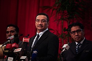Malaysia's Minister of Defence and acting Minister of Transport Hishammuddin Hussein (C) 