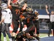 Gilmer's Demarco Boyd (5) celebrates teammate Devin Smith's (3) fumble recovery for a touchdown during the third quarter of the Buckeyes' 35-25 win over West Orange-Stark in the Class 4A Division II championship game Friday at AT&T Stadium in Arlington. (Jeff Stapleton, ETSN.fm)