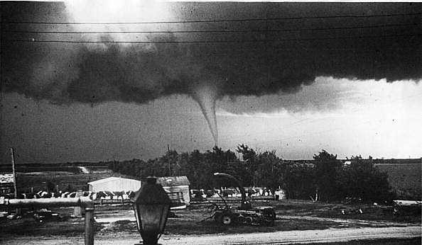 May 26th 1959: The destructive funnel cloud of a tornado touches ground.