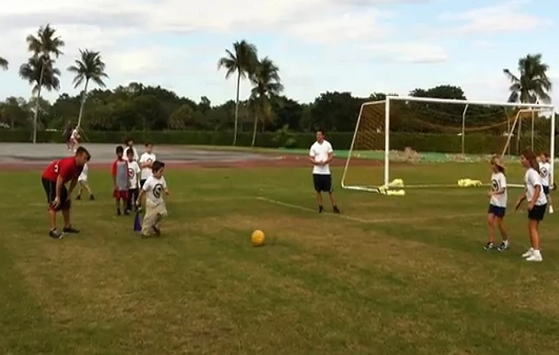 Florida kids playing kick ball