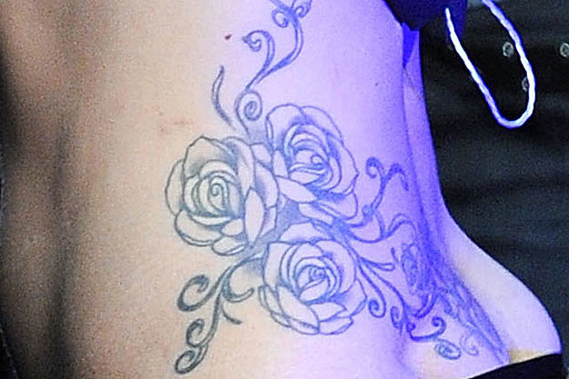 Do you think you can identify the pop star who has this rose tattoo inked on