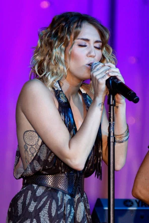 That dream catcher tattoo is imprinted on none other than Miley Cyrus