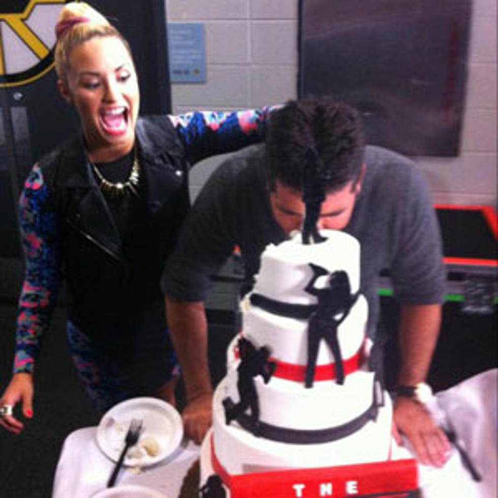 Demi Lovato Plants Simon Cowell&#8217;s Face into &#8216;X Factor&#8217; Cake + More