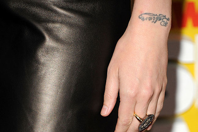  indication that a woman is behind the Believe tattoo in this photo