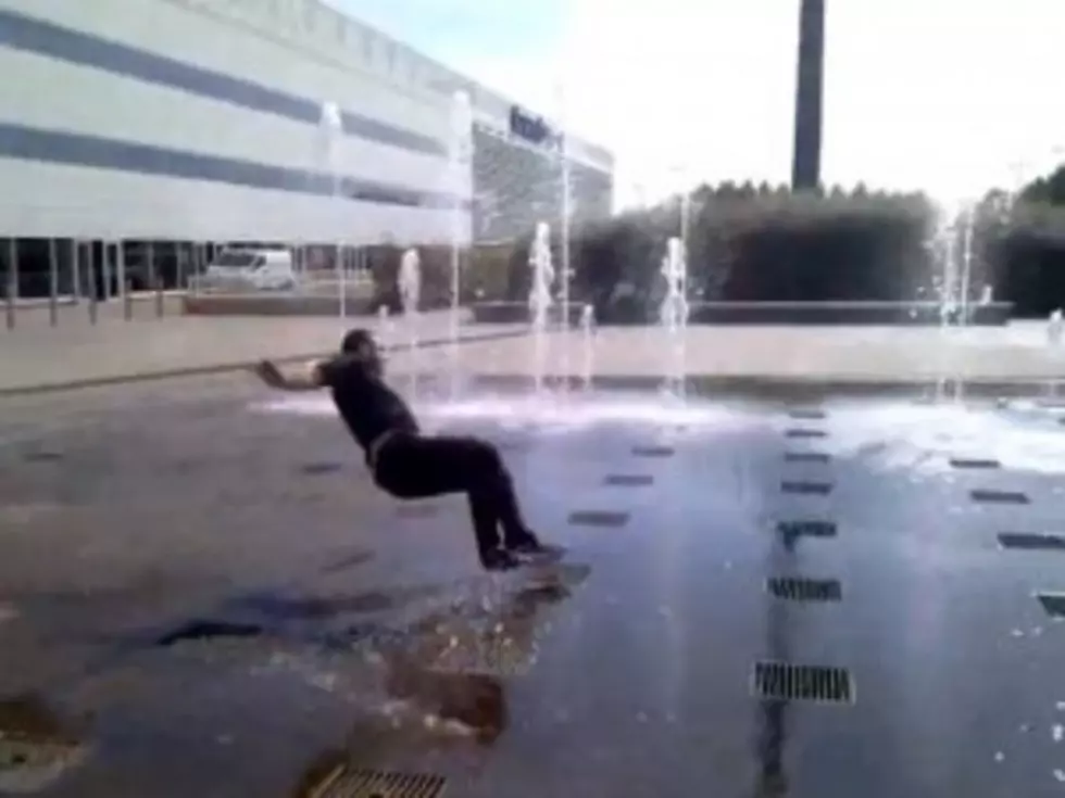 Dumb Guy Falls While Crossing Fountain [VIDEO]