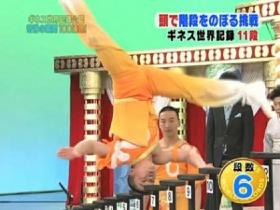 Acrobat Climbs 15 Stairs on His Head [VIDEO]