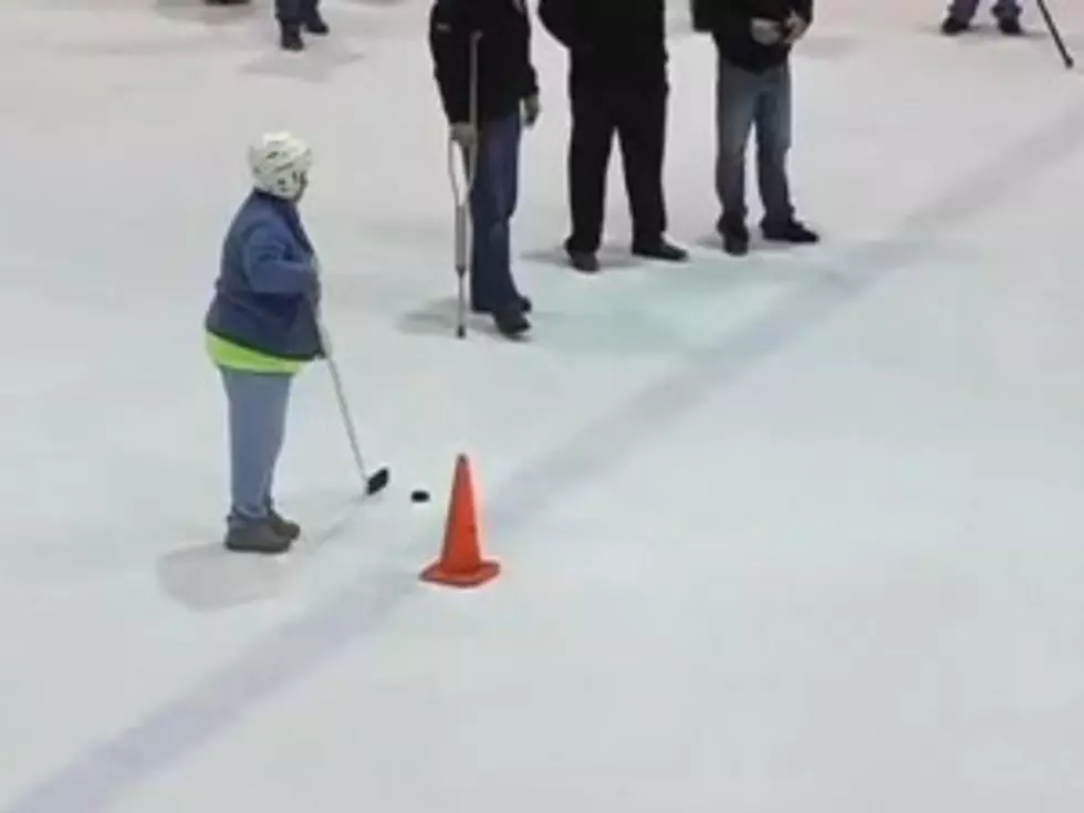 Watch a 59-Year-Old Woman Win a Truck With an Unbelievable Hockey Goal [VIDEO]