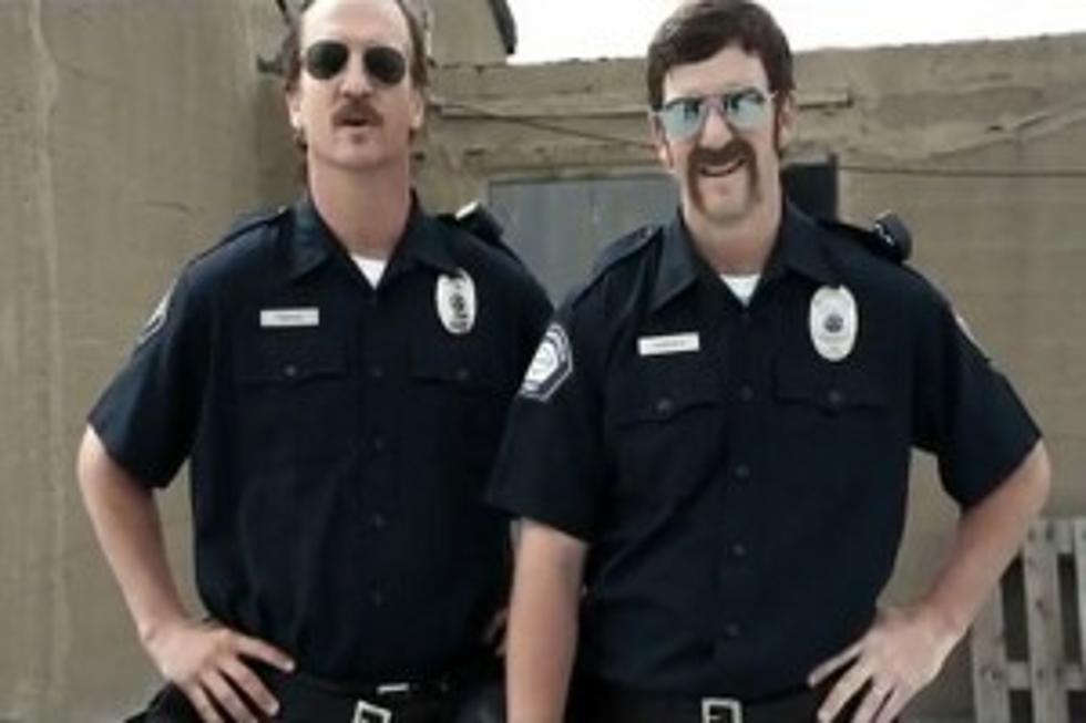The Manning Brothers Ham It Up As &#8216;Football Cops&#8217; in Hilarious New Video [VIDEO]
