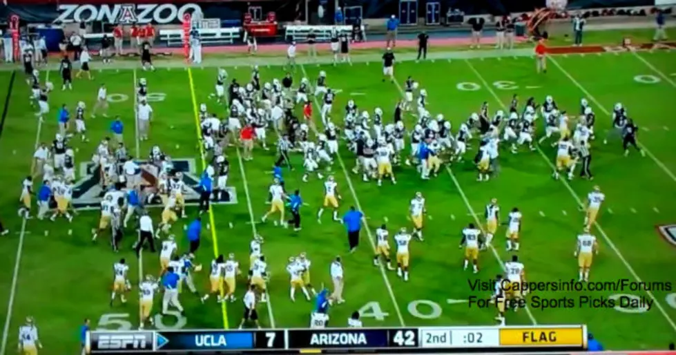 UCLA and Arizona Players Brawl After a Streaker Disguised as Referee Runs on the Field [VIDEO]